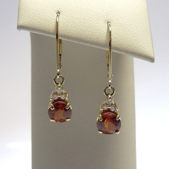 14k yellow dangle earrings with spessartite garnets and diamonds