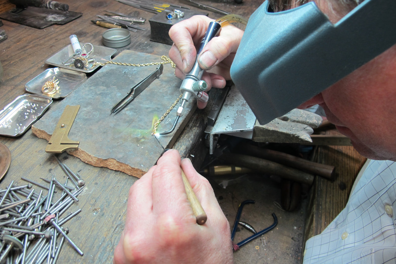 Jon at workbench repair photo with soldering iron