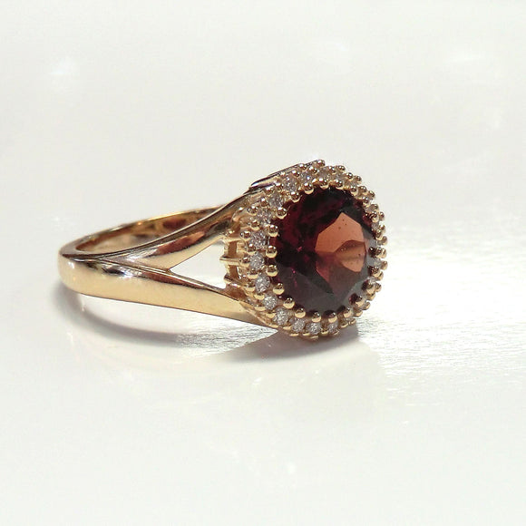 14k rose halo ring with garnet and diamonds