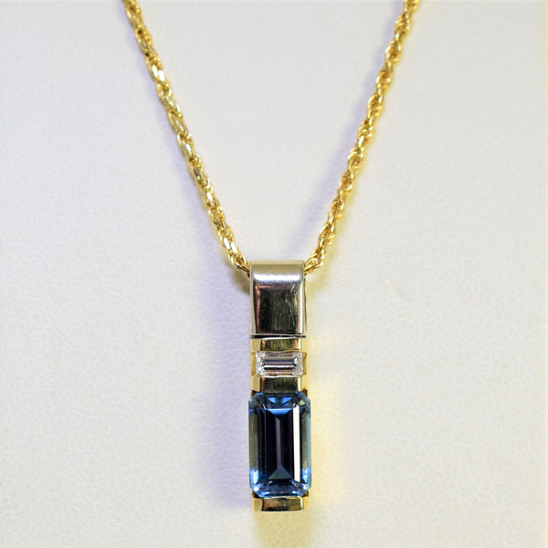 14k two-tone blue topaz and diamond pendant
