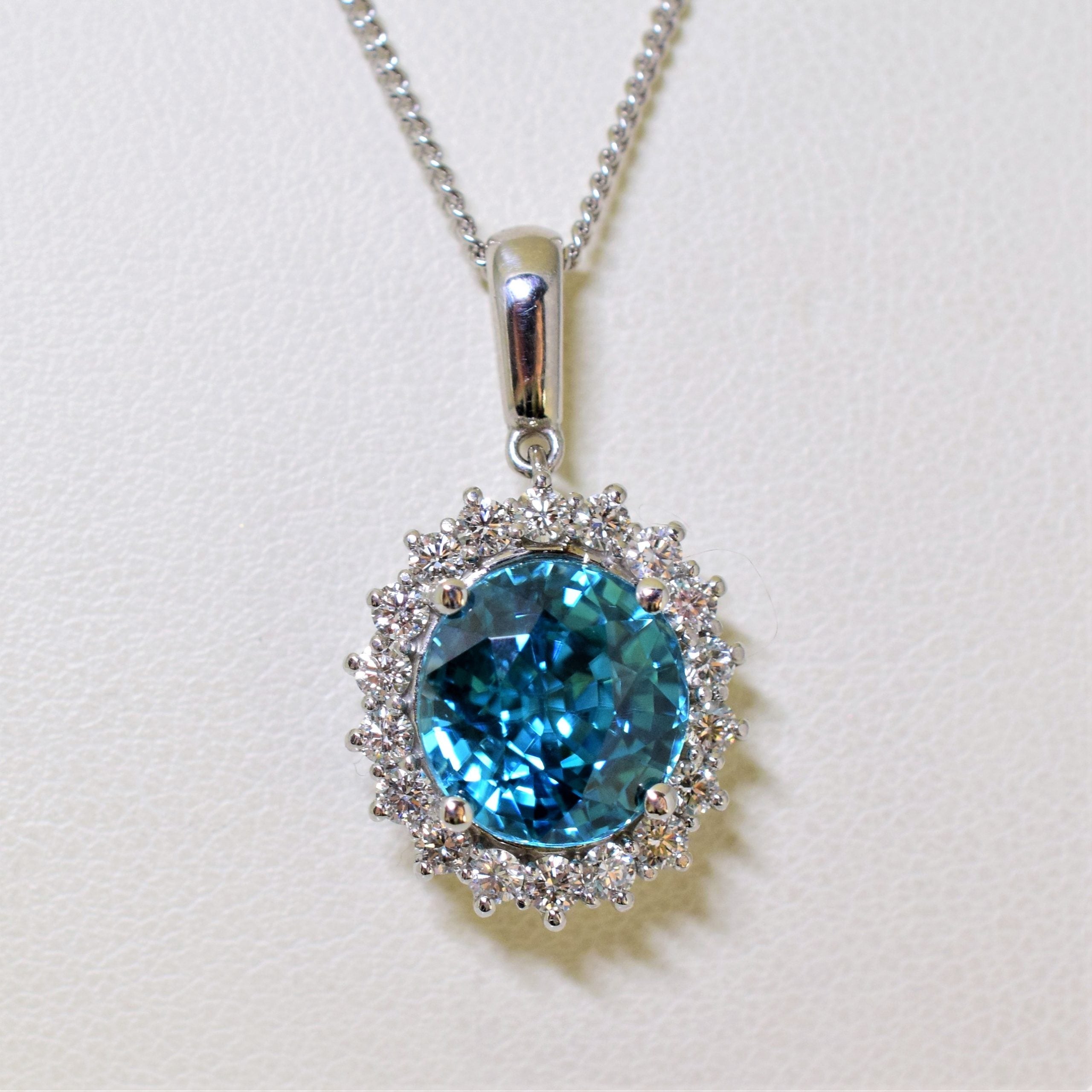14k white gold blue zircon and diamond pendant – Jonathan's Jewelers