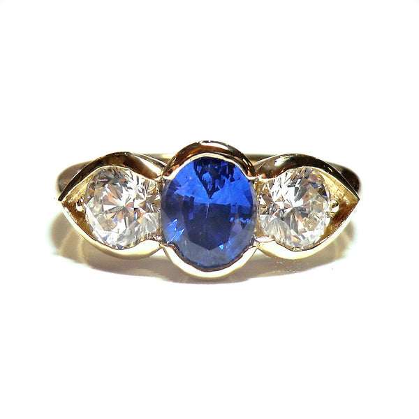 Custom 14 karat yellow gold sapphire and diamond ring
