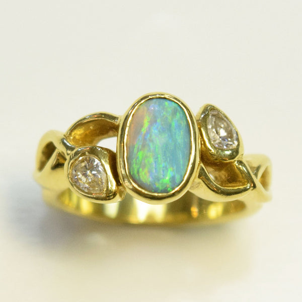 Custom 18 karat ring with opal and diamonds