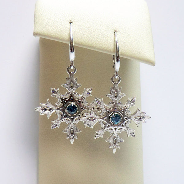 Custom sterling silver snowflake earrings with blue zircon