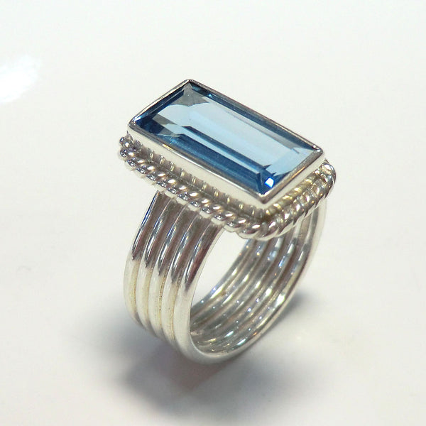 White sterling silver ring with blue topaz